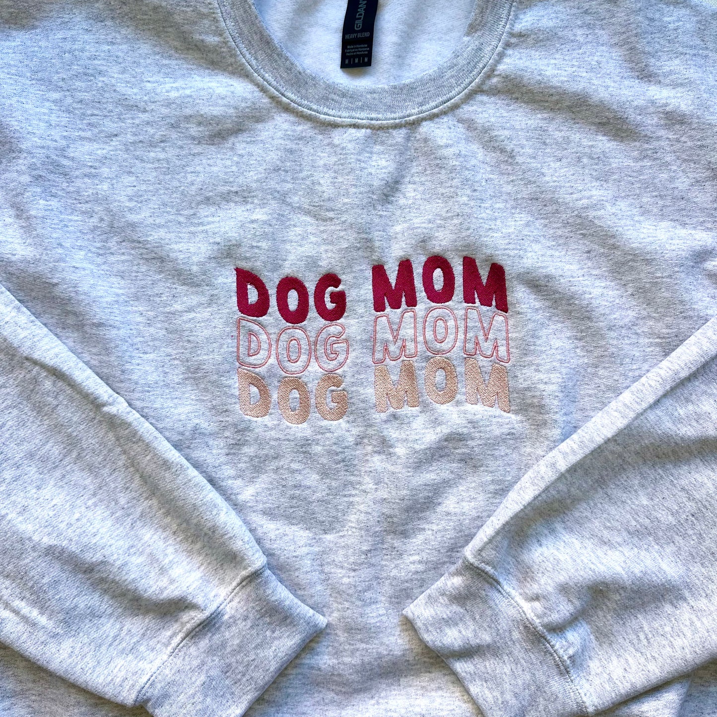 “Dog Mom Dog Mom Dog Mom” Embroidered Unisex Sweatshirt