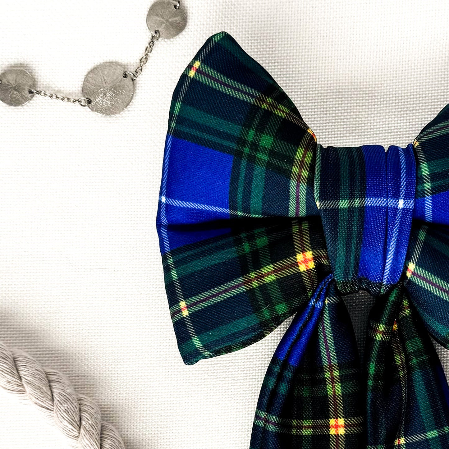 Close up view of a Nova Scotia Tartan sailor dog bow.