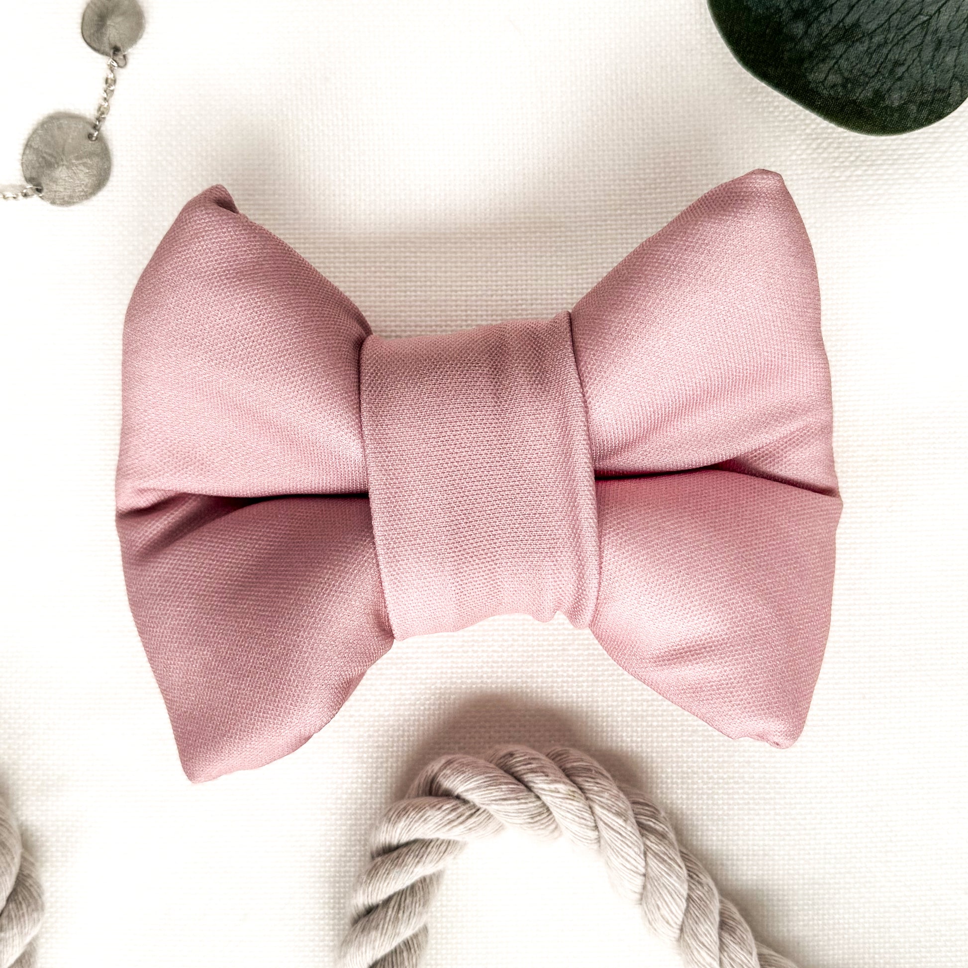 A pink classic dog bowtie.