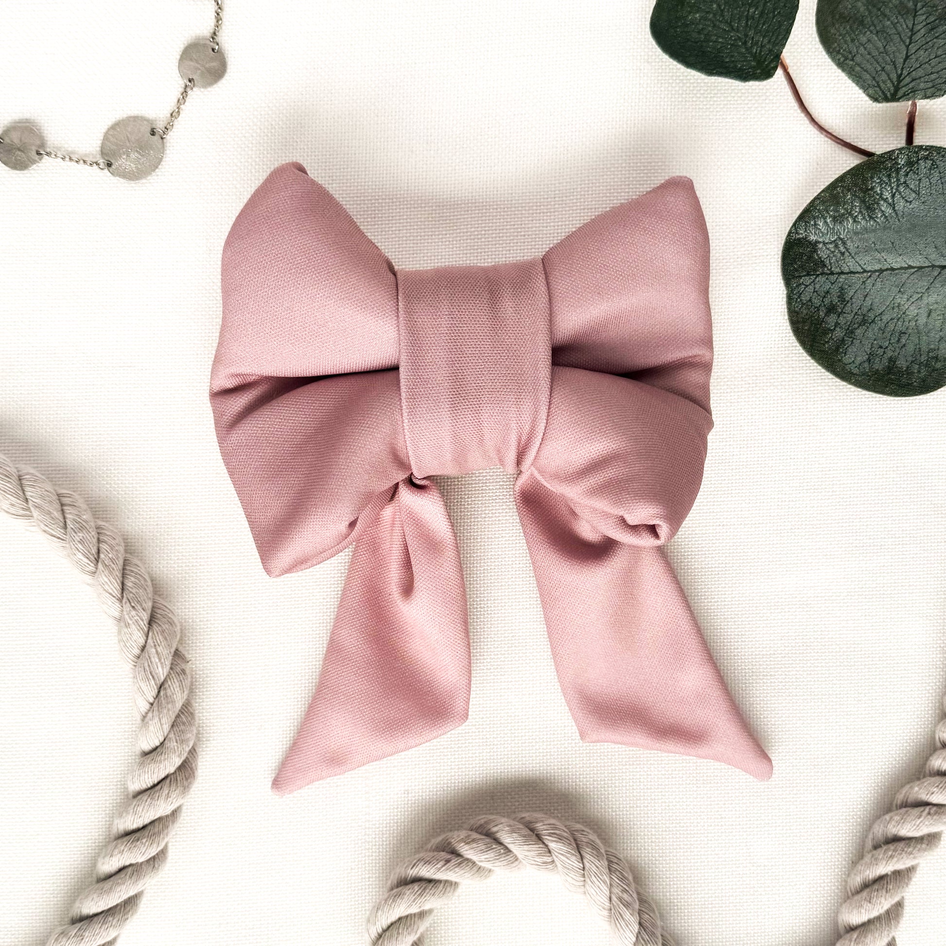 A pink dog sailor bow.