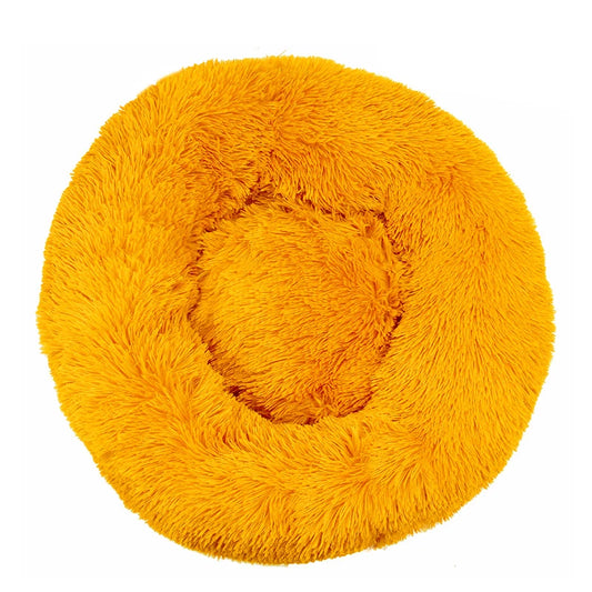A yellow plush dog bed shaped like a donut, offering a comfortable and secure space for small dogs to curl up and relax.